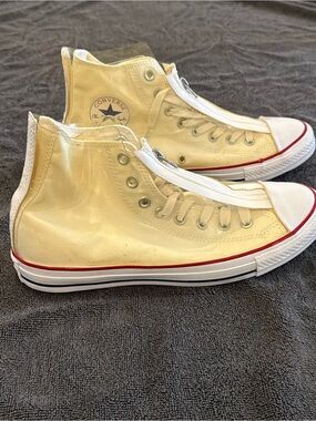 Converse white High Top Sneakers with vinyl zip cover.